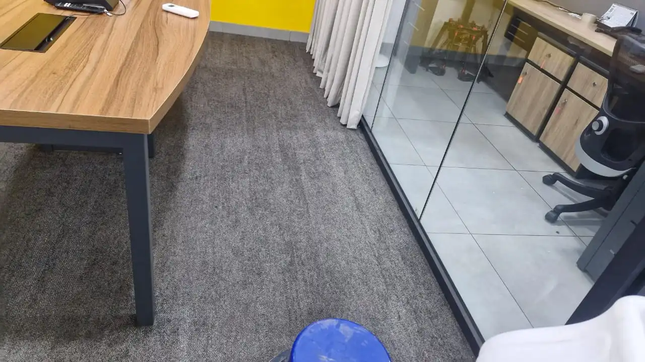Freshly cleaned office carpet near workstation