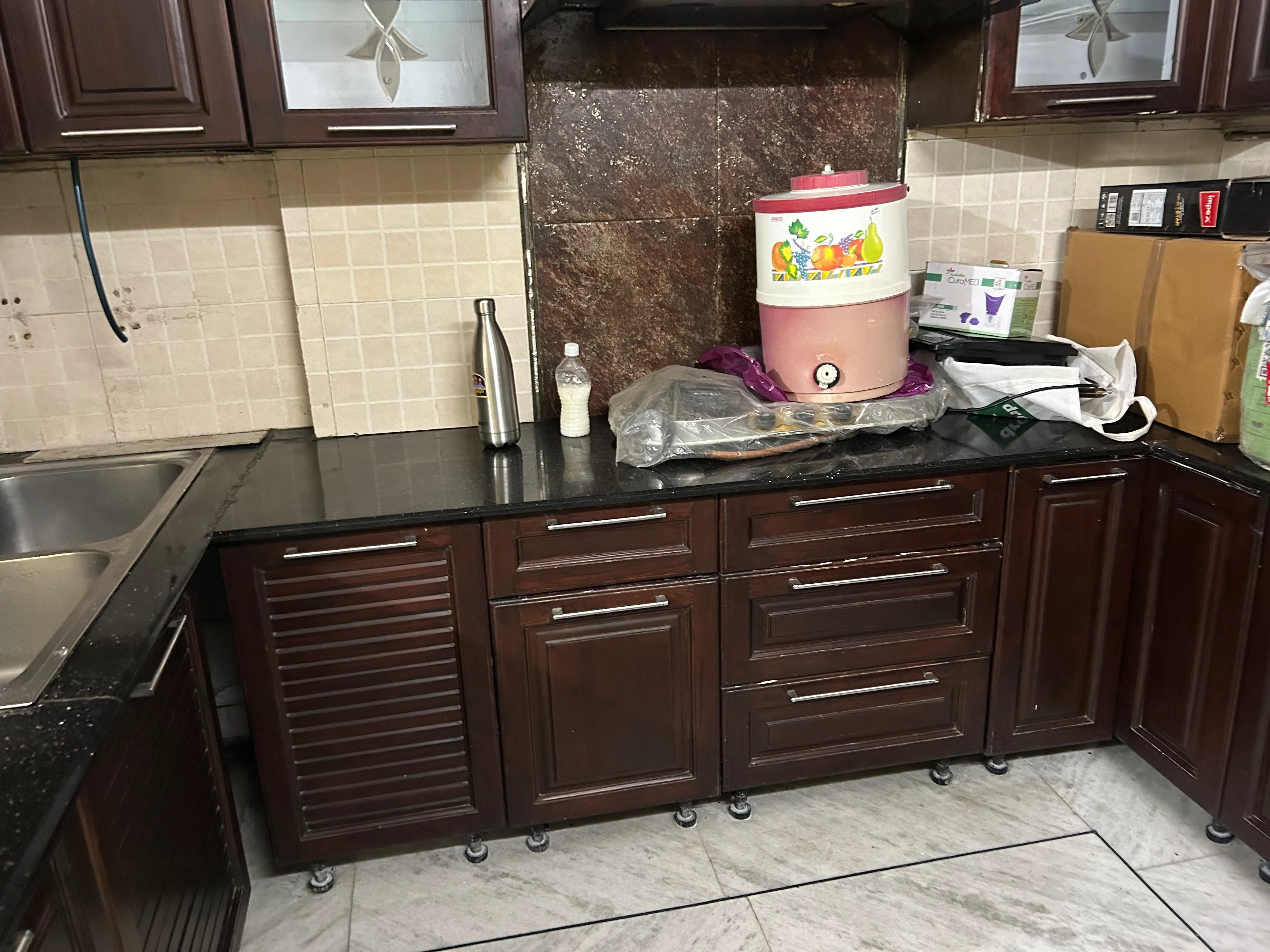Close-up of kitchen counter and backsplash before treatment