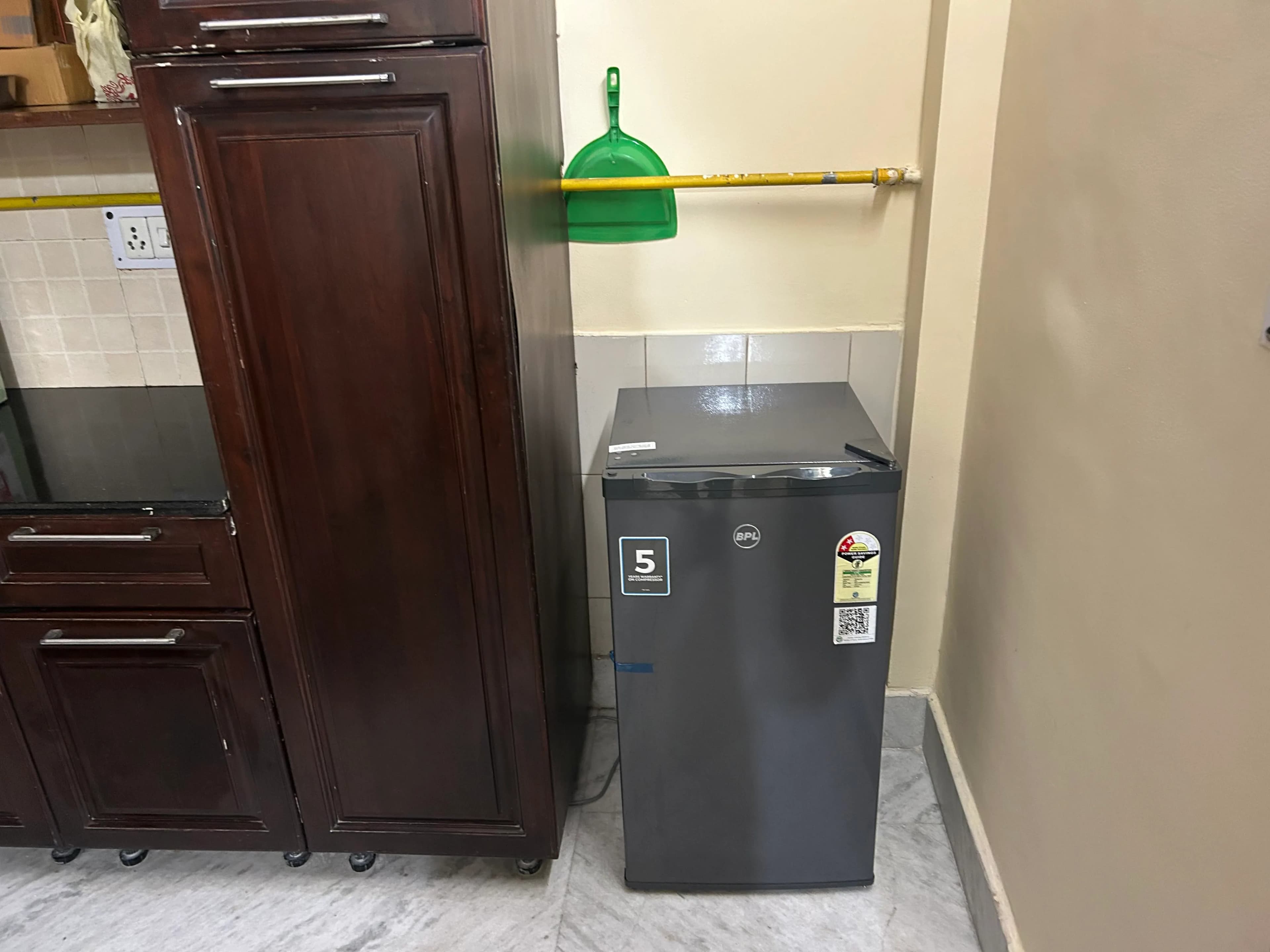 Detailed cleaning around refrigerator and utility corner